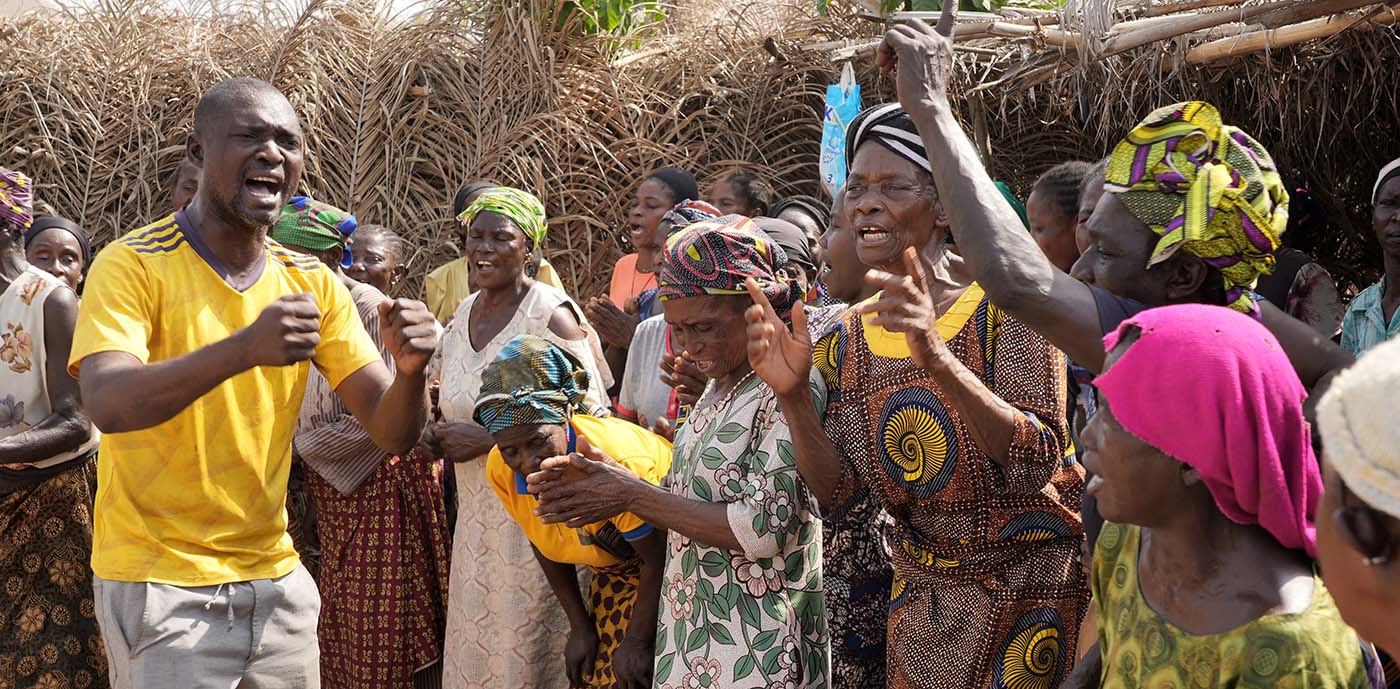 Pastor Barnabas worships with other Nigerian Christians in an IDP camp