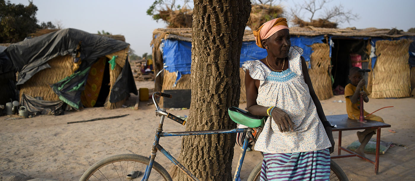 Pastor Sore's mother with a bicylce